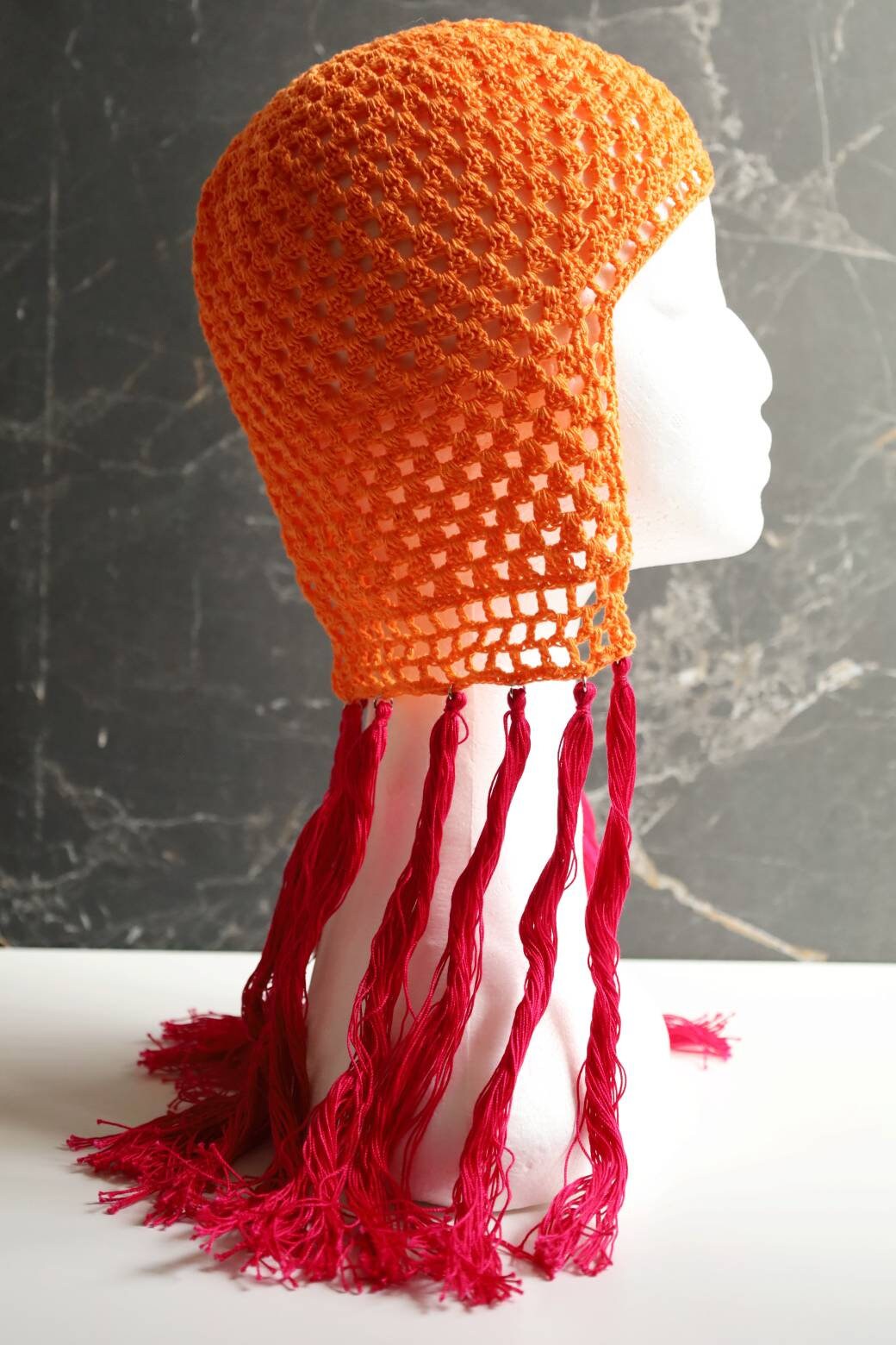 Orange helmet with pink tassels Orange Pink hair