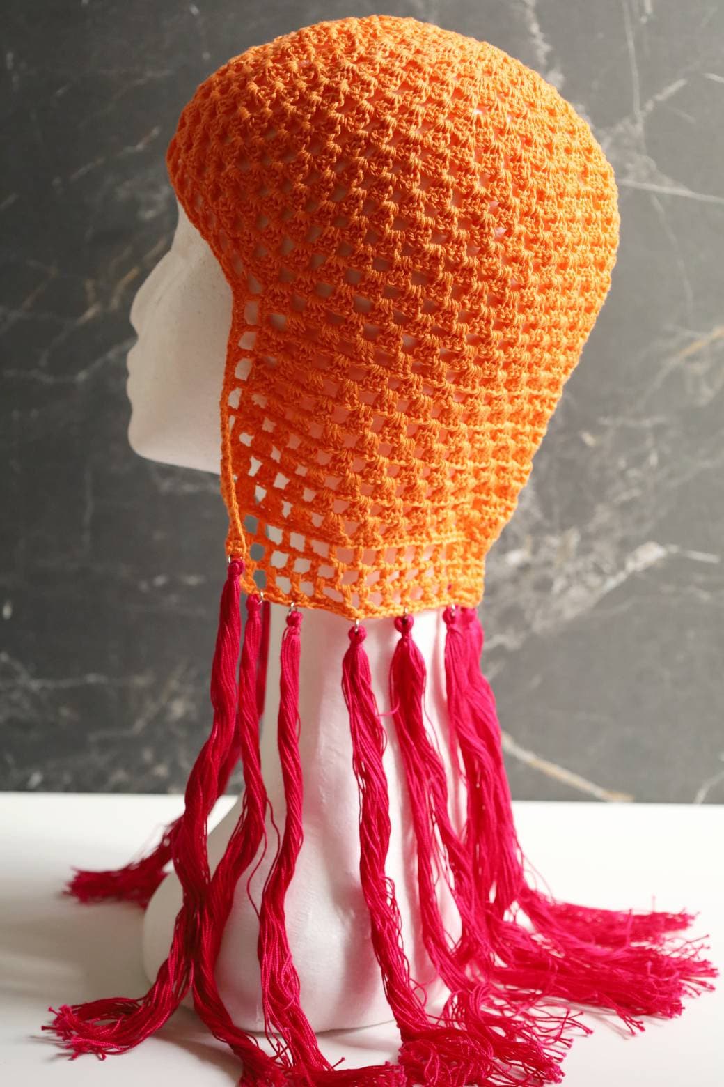 Orange helmet with pink tassels Orange Pink hair