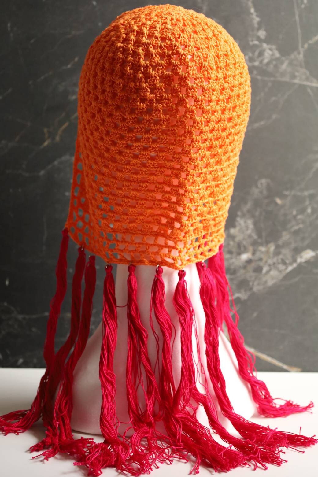 Orange helmet with pink tassels Orange Pink hair